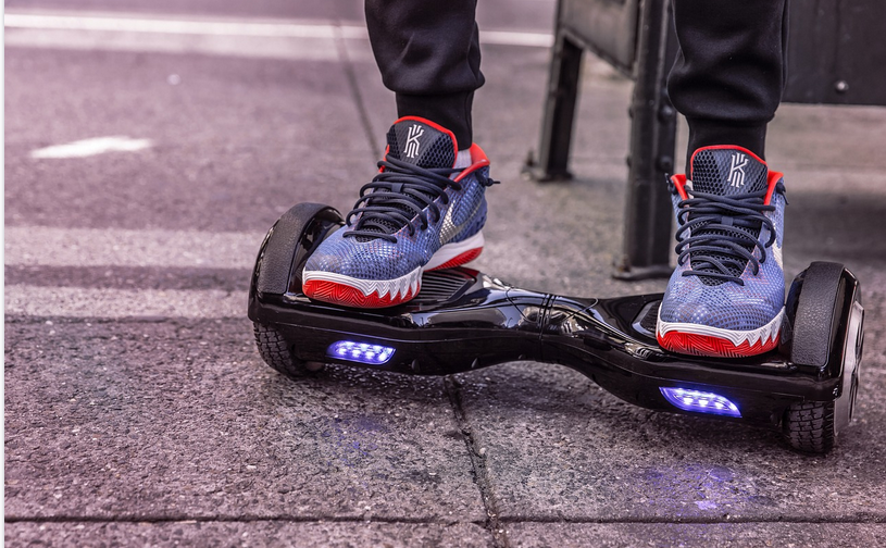 a man riding a hoverboard